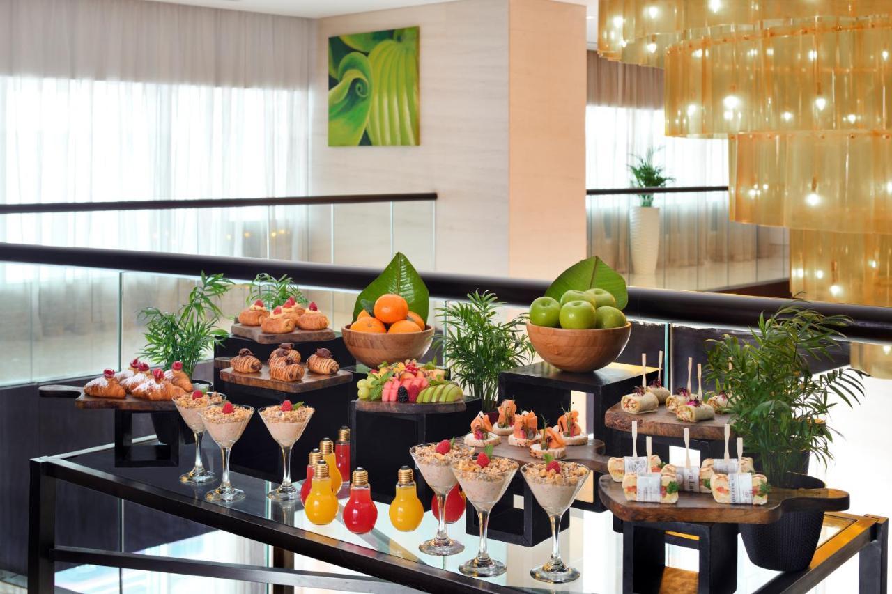 Moevenpick Hotel Jumeirah Lakes Towers Dubai Exterior photo A dessert buffet