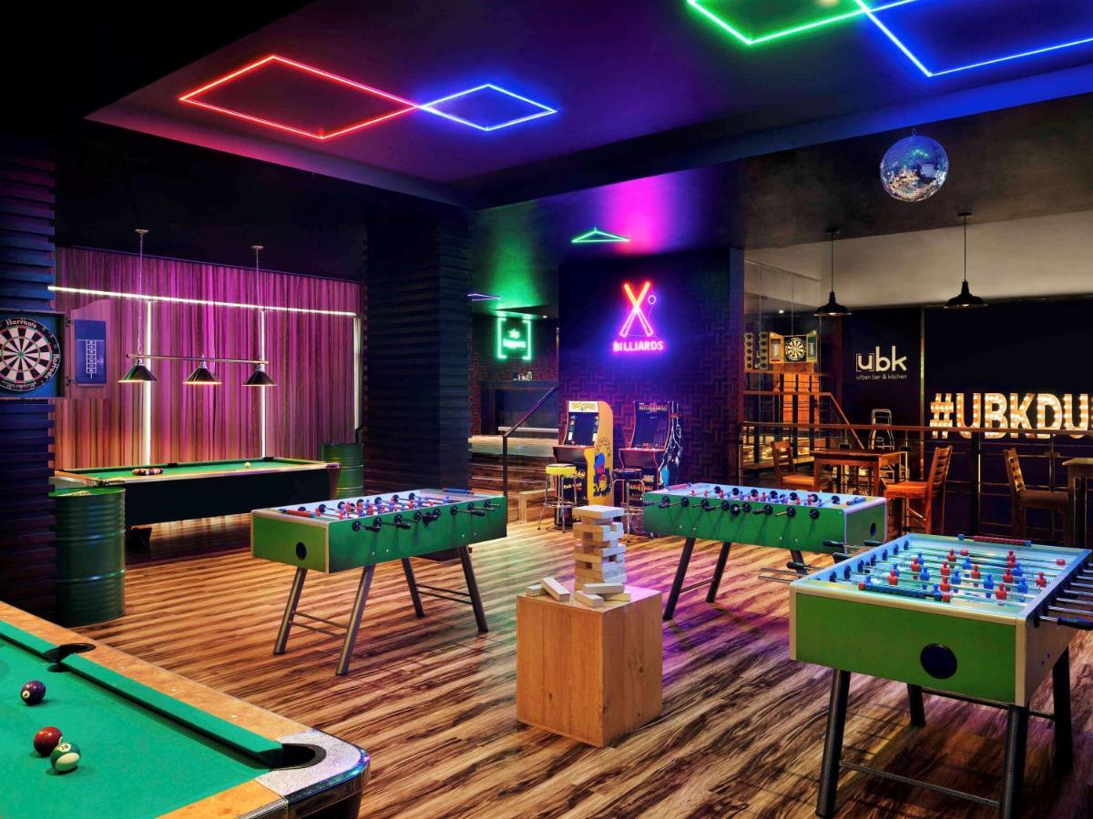 Moevenpick Hotel Jumeirah Lakes Towers Dubai Exterior photo The games room at the UBU