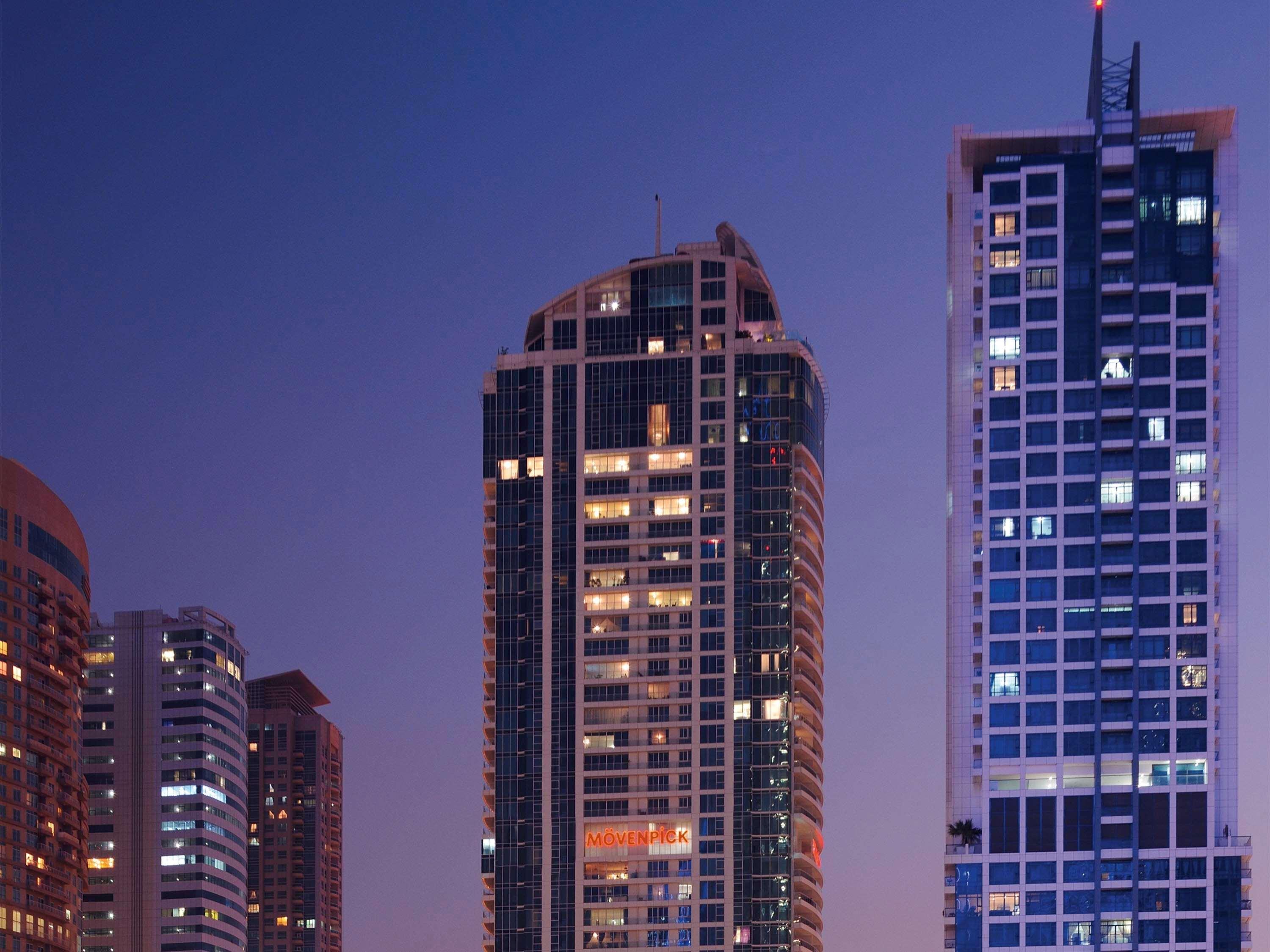Moevenpick Hotel Jumeirah Lakes Towers Dubai Exterior photo The building at night
